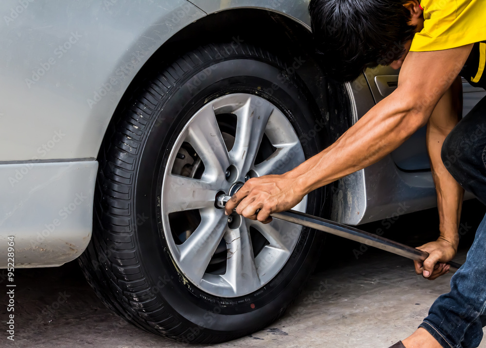 Car wheel change by mechanic Car wheel change by mechanic