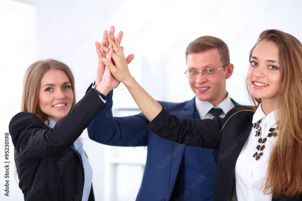 Business people group joining hands and representing concept of friendship and teamwork Business people group joining hands and representing concept of friendship and teamwork