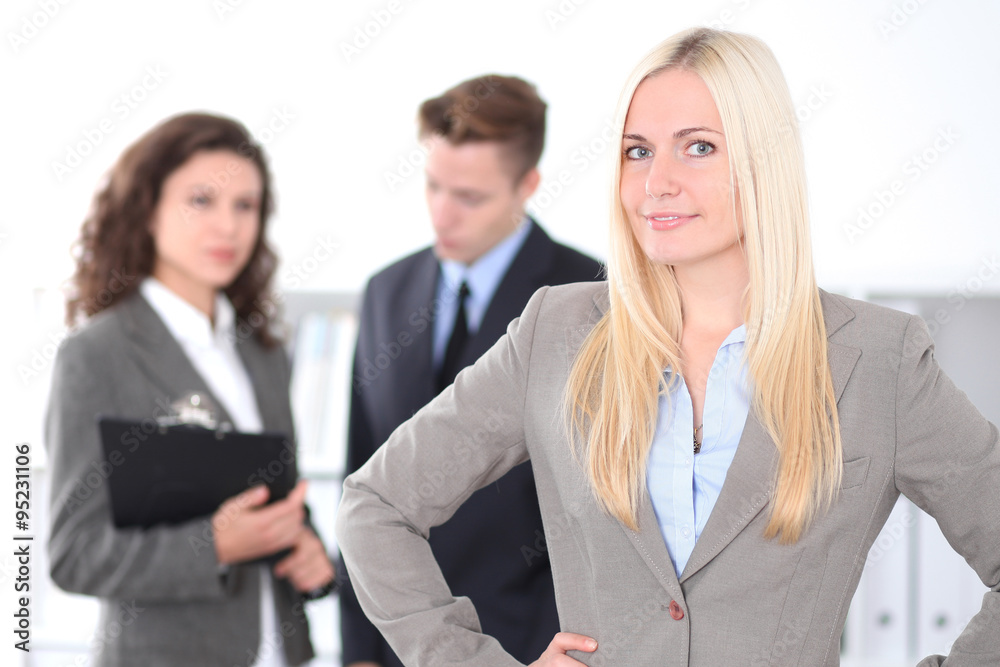 Face of beautiful cheerful smiling business woman on the background of business people Successful business concept Face of beautiful cheerful smiling business woman on the background of business people Successful business concept