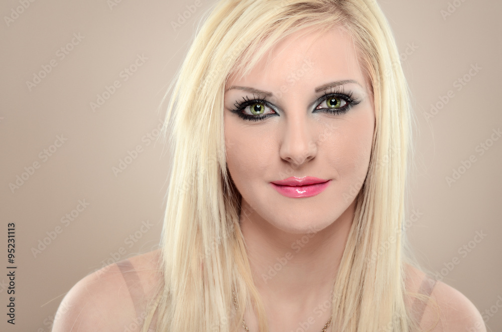 Close-up portrait of sexy blonde girl with green cat eyes Close-up portrait of sexy blonde girl with green cat eyes