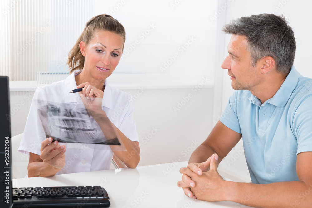 Doctor And Patient Checking X-ray Doctor And Patient Checking X-ray