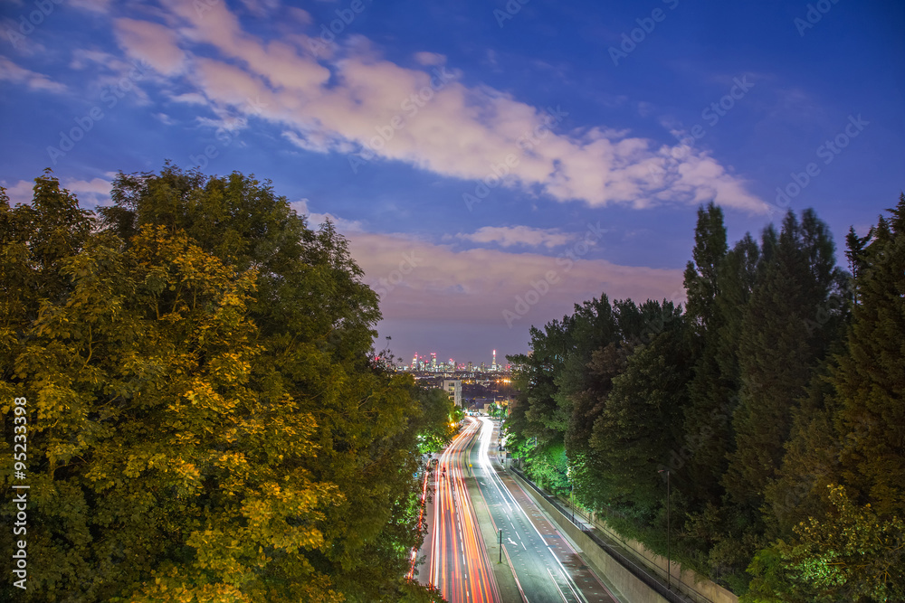 Fototapeta premium Skyline of central London after sunset from Holloway Bridge, UK