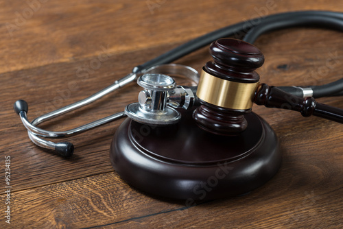 Gavel And Stethoscope On Table