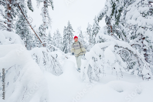 Middle-aged woman snowshoeing