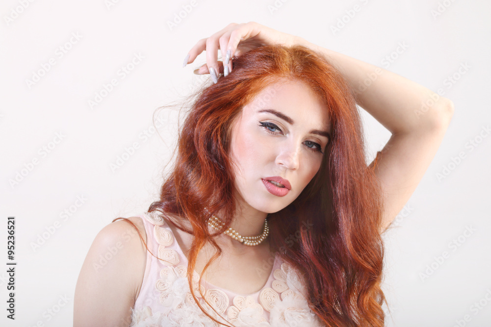 Closeup portrait beautiful young smiling girl with hand on head Closeup portrait beautiful young smiling girl with hand on head
