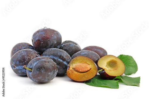Fresh plums isolated on white background. 