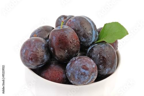 Fresh plums isolated on white background. 