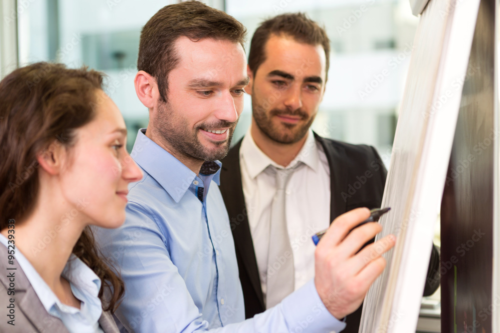 Group of business associates working together at the office Group of business associates working together at the office