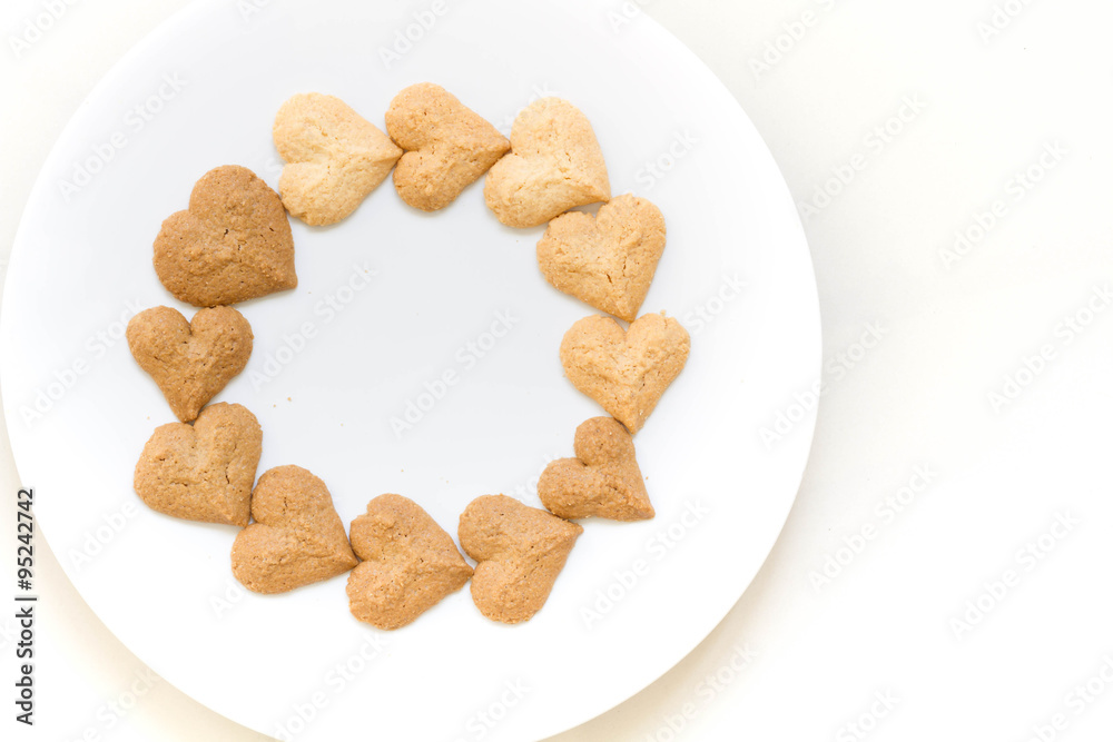 Chocolate cookies and butter cookies on white dish on white background Chocolate cookies and butter cookies on white dish on white background