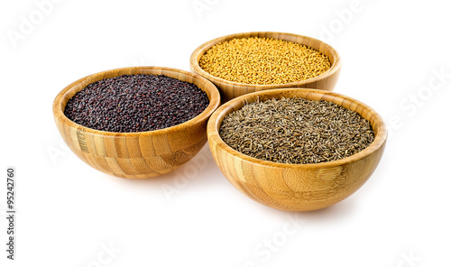 Traditional Asian cooking spices isolated in bamboo bowls