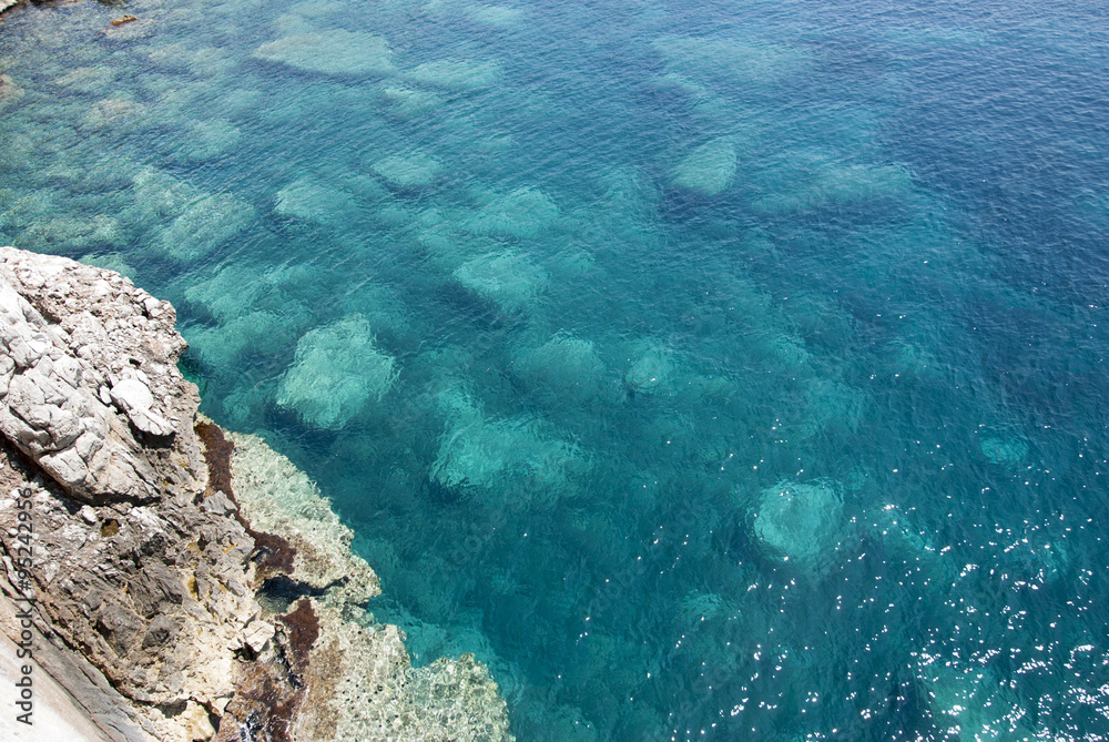 Sardinian crystal sea seen from the top with rocks