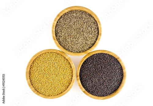 Tasty mustard (yellow, black) and cumin isolated on white