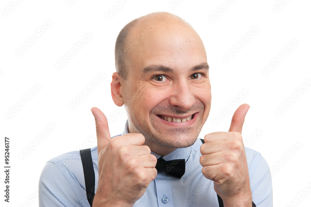 successful bald man showing his thumbs up successful bald man showing his thumbs up