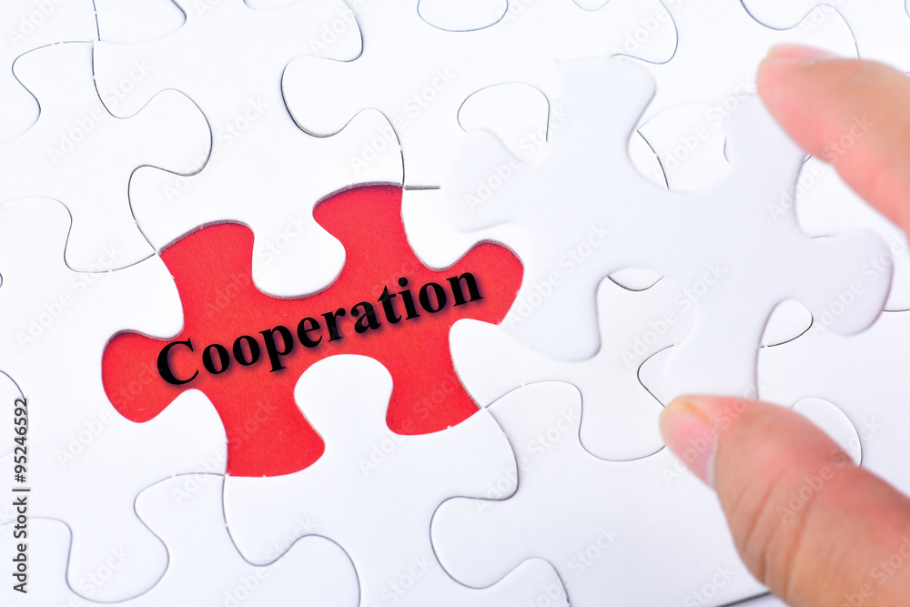 Missing jigsaw puzzle piece with word Cooperation Missing jigsaw puzzle piece with word Cooperation