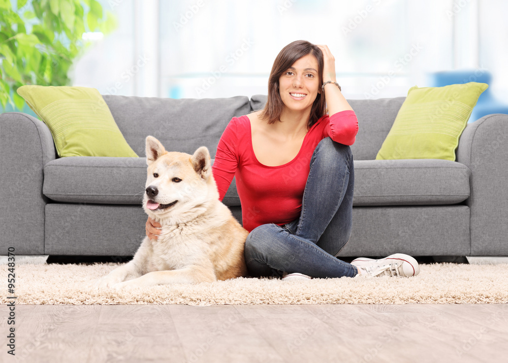 Woman sitting with her dog at home Woman sitting with her dog at home