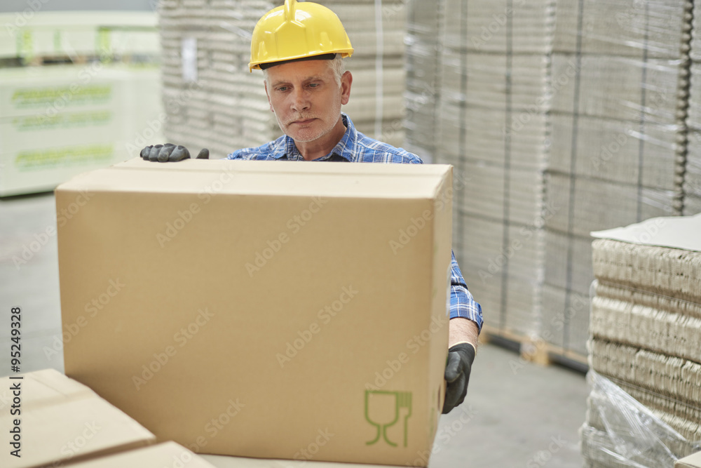 Hard working mature man in warehouse Hard working mature man in warehouse