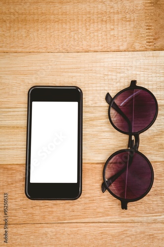 View of glasses and a smartphone