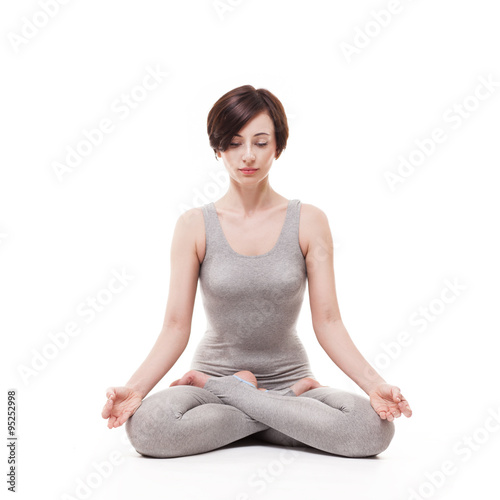 young beautiful woman yoga posing. isolated
