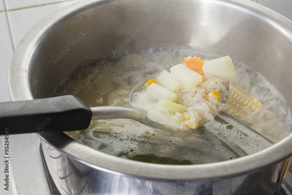 vegetarian porridge while boiling in stainless pot vegetarian porridge while boiling in stainless pot