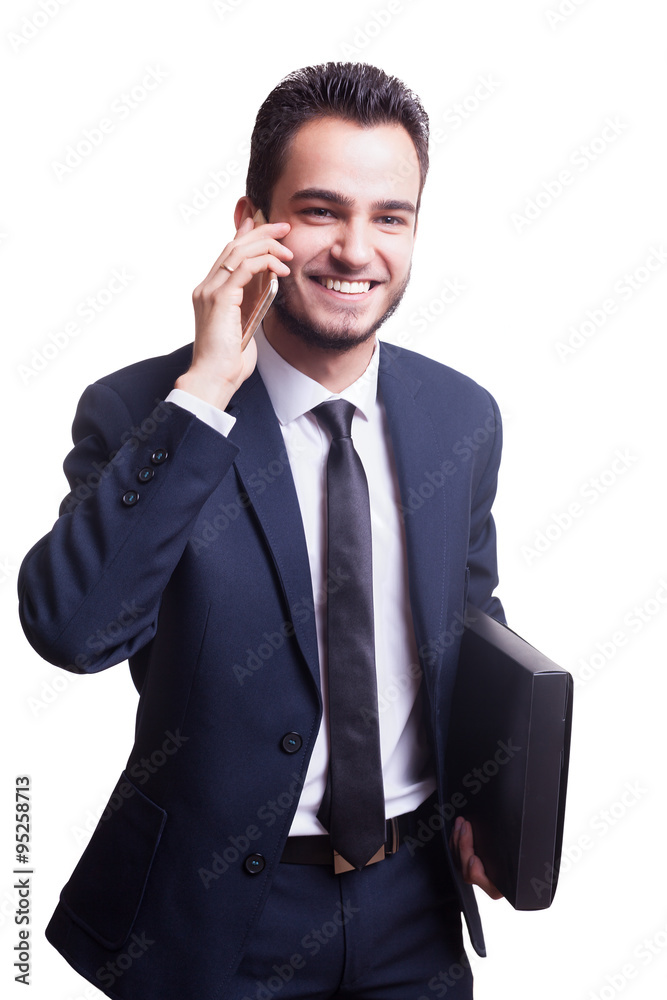 Happy businessman in suit smiling while talking on the phone Happy businessman in suit smiling while talking on the phone