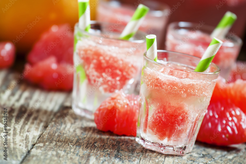 Cocktail with vodka, soda and grapefruit with striped straws, se Cocktail with vodka, soda and grapefruit with striped straws, se