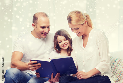 happy family with book at home