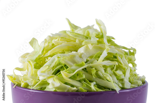 sliced cabbage in purple bowl