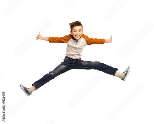 happy smiling boy jumping in air