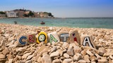 Croatia name on stones and dalmatian town