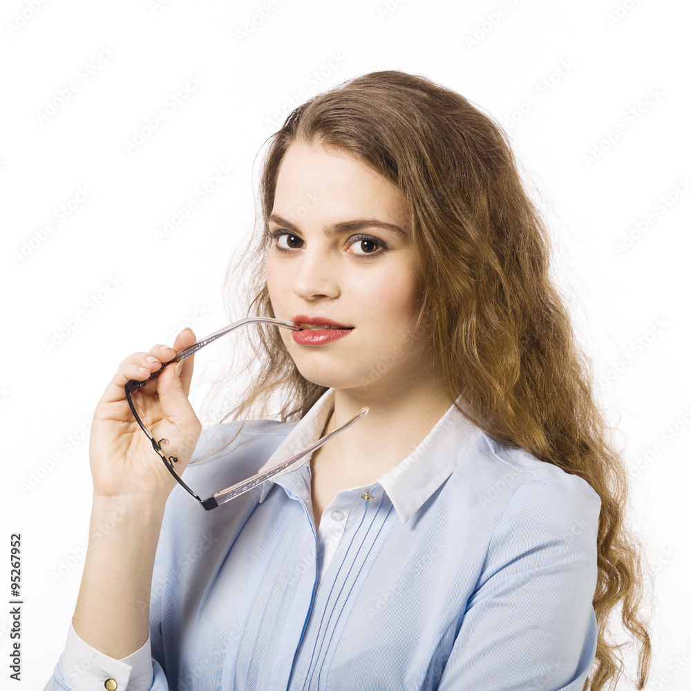 Portrait of a beautiful smiling young woman dressed in a blue sh Portrait of a beautiful smiling young woman dressed in a blue sh