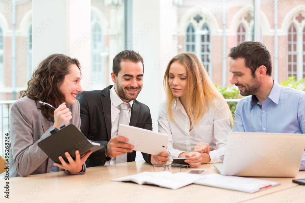 Group of business people working together at the office Group of business people working together at the office