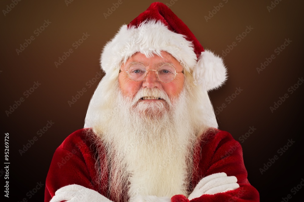 Composite image of santa smiles with folded arms Composite image of santa smiles with folded arms
