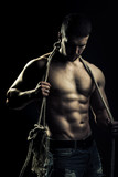 Muscular man with rope