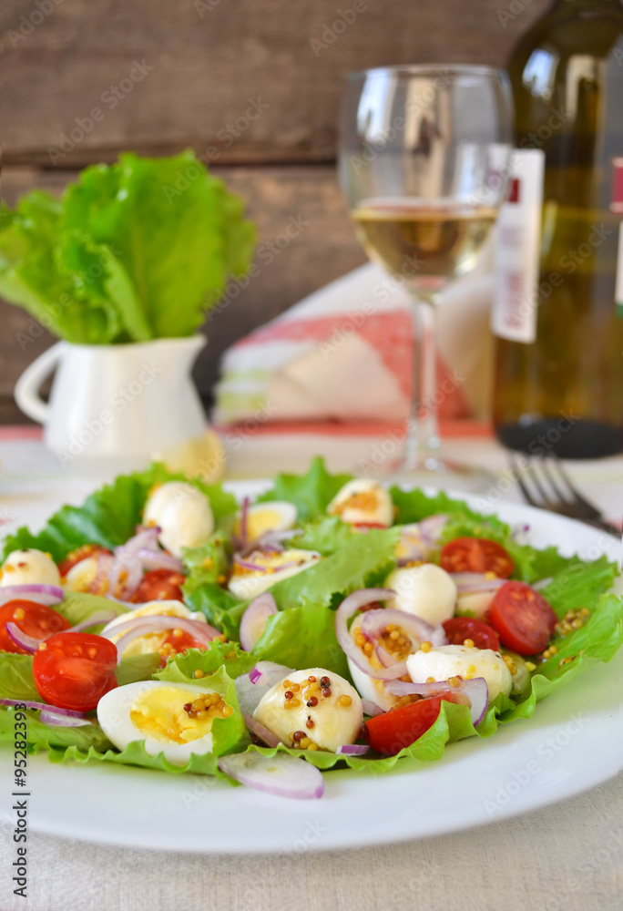 Salad with mozzarella and cherry tomatoes Salad with mozzarella and cherry tomatoes