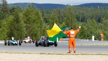 Fototapete Motorsport marshall in final lap historical race  © Jaroslav Uher
