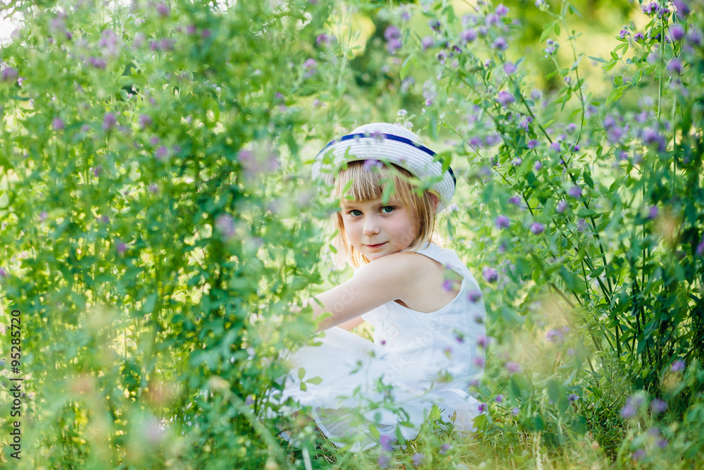 Summer portrait of cute little girl in white retro hat. Summer portrait of cute little girl in white retro hat.