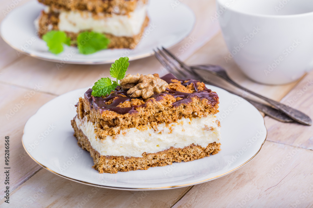 Slice of honey cake on plate and cup of coffee Slice of honey cake on plate and cup of coffee