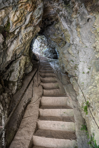 Stone Staircase in a Corridor in the Cave. Passage through the Rock.