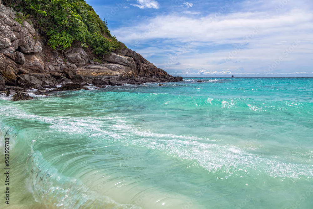 Turquoise waves on the island of Ko Racha Yai. Thai Phuket Province