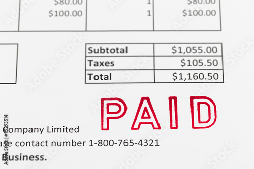 Invoice with paid stamp; document is mock-up