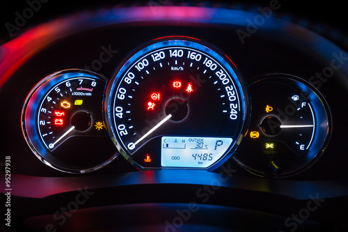 Modern car instrument dashboard panel  in night time