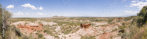 Panoramic view of ravine Olduvai Gorge, one of the most important paleoanthropological sites in the world - the Cradle of Mankind. Great Rift Valley, Tanzania, Eastern Africa.