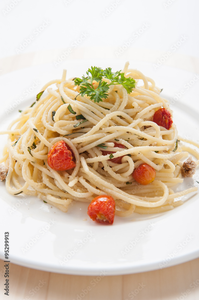 Spaghetti pasta with cherry tomatoes, basil and parmesan cheese, selective focus Spaghetti pasta with cherry tomatoes, basil and parmesan cheese, selective focus