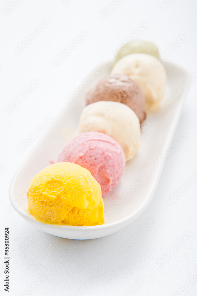 Mixed ice creams in bowl on white background Mixed ice creams in bowl on white background