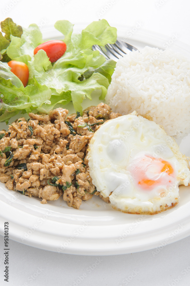 Thai spicy food basil pork with rice and fried egg on top (Krapa Thai spicy food basil pork with rice and fried egg on top (Krapa