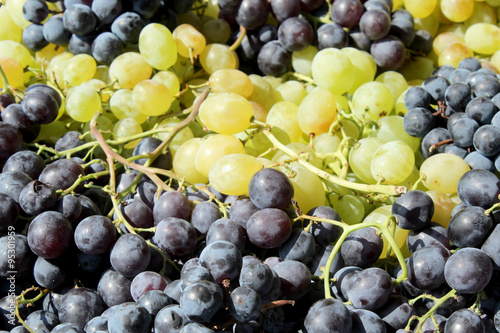 Green and rose grapes background 