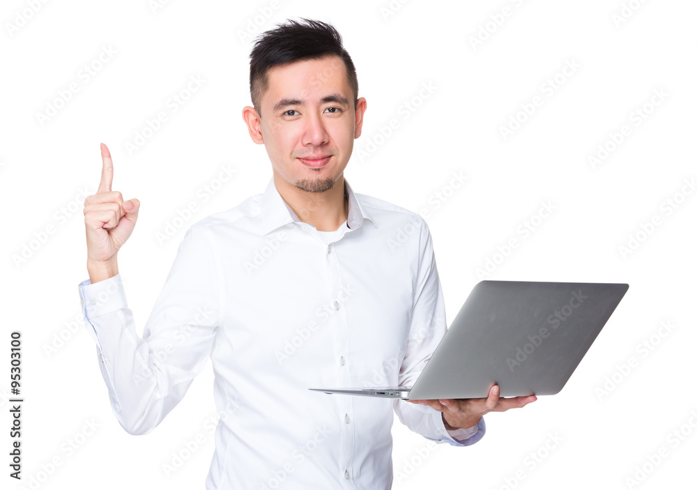 Businessman hold with laptop computer and finger point up Businessman hold with laptop computer and finger point up