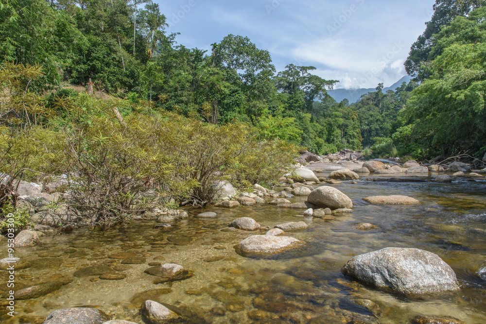 Un-focus image of Brook and rocks in the mountains at Kiriwong v Un-focus image of Brook and rocks in the mountains at Kiriwong v