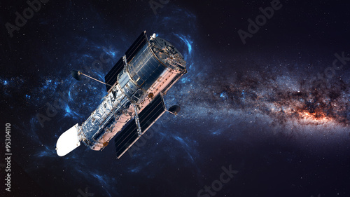 Obraz na płótnie The Hubble Space Telescope in orbit above the Earth. Elements of this image furnished by NASA w salonie