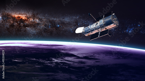 Fotografija The Hubble Space Telescope in orbit above the Earth